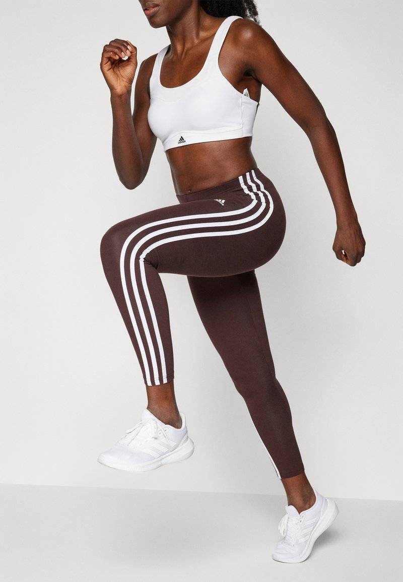adidas Sportswear adidas Sportswear ESSENTIALS 3 STRIPES HIGH WAISTED - Leggings - shadow brown Top Angebot