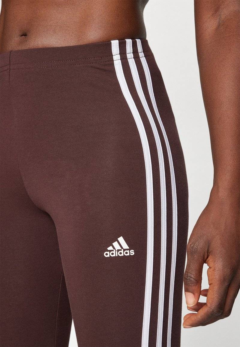 adidas Sportswear adidas Sportswear ESSENTIALS 3 STRIPES HIGH WAISTED - Leggings - shadow brown Top Angebot