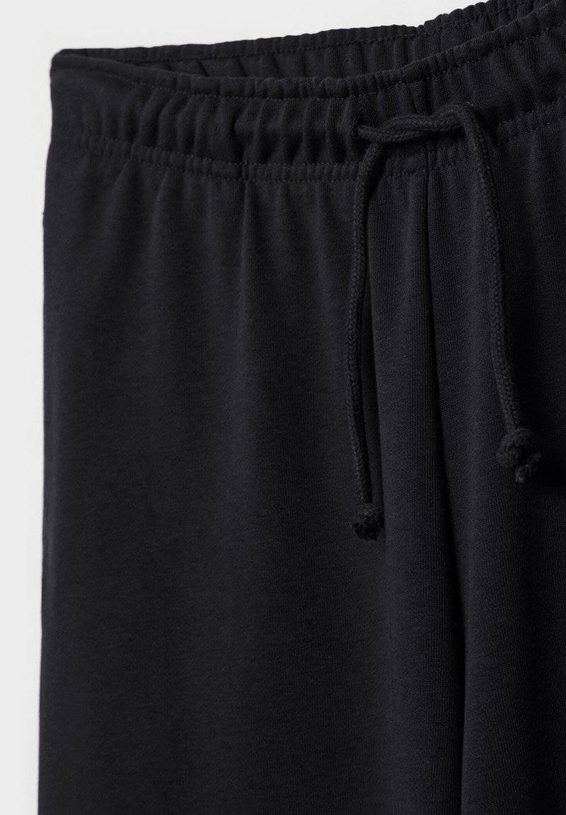 Stradivarius Stradivarius WIDE-LEG JOGGER - Tracksuit bottoms - black Im Verkauf