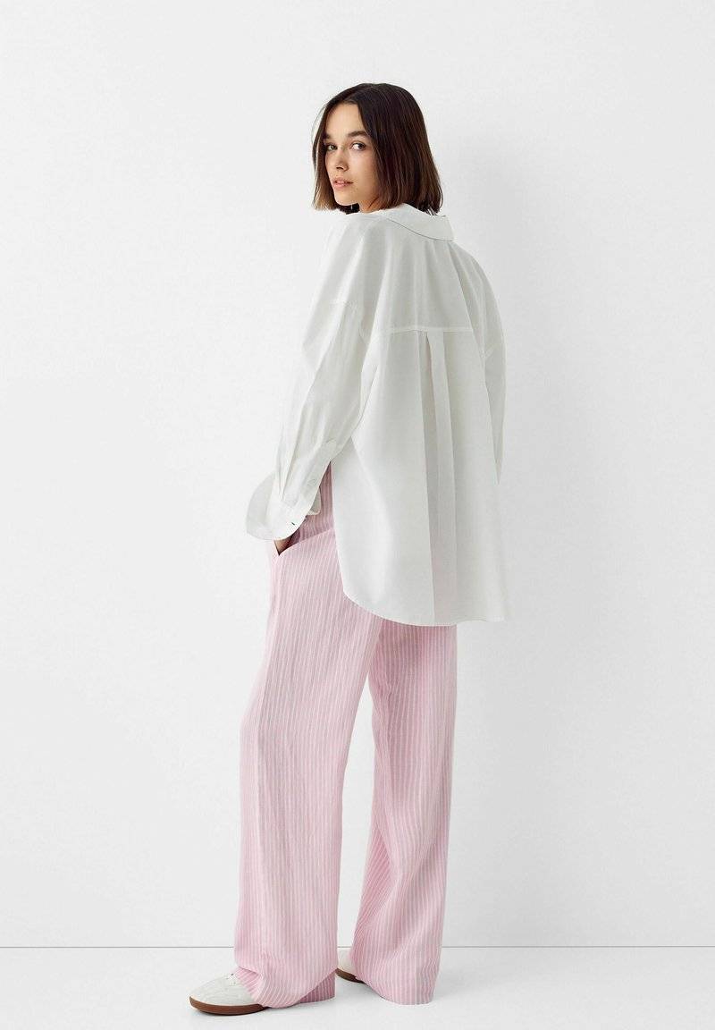 Bershka Bershka WITH AN ELASTIC - Trousers - light pink Begrenzt auf 3 Tage