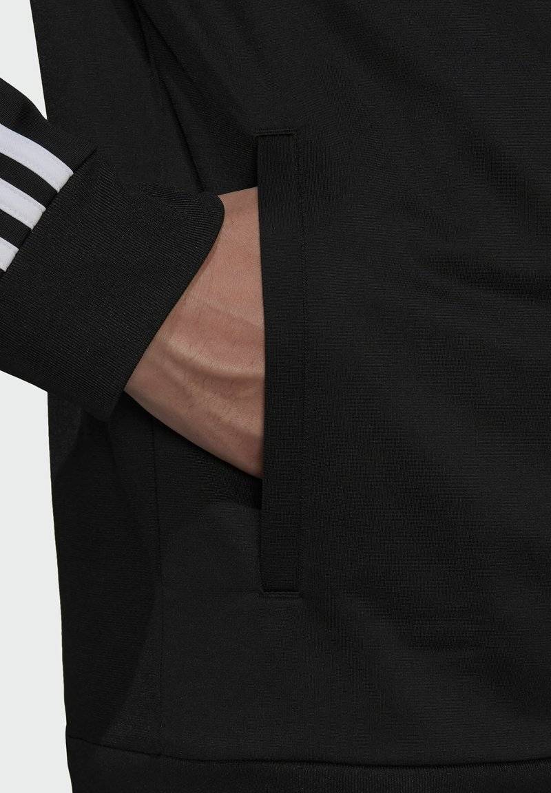 adidas Sportswear adidas Sportswear ESSENTIALS WARM-UP REGULAR 3-STRIPES - Training jacket - black Bestseller