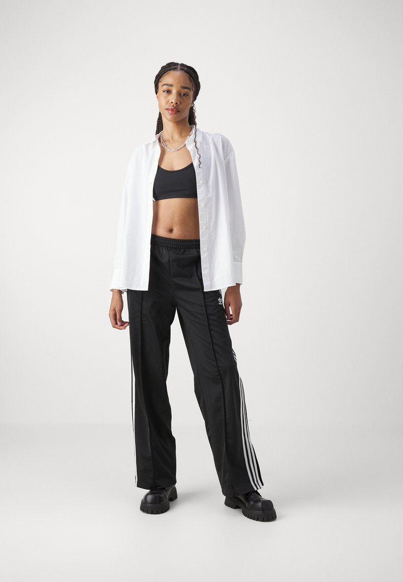 adidas Originals adidas Originals FBIRD LOOSE - Tracksuit bottoms - black Sonderangebot der Fabrik