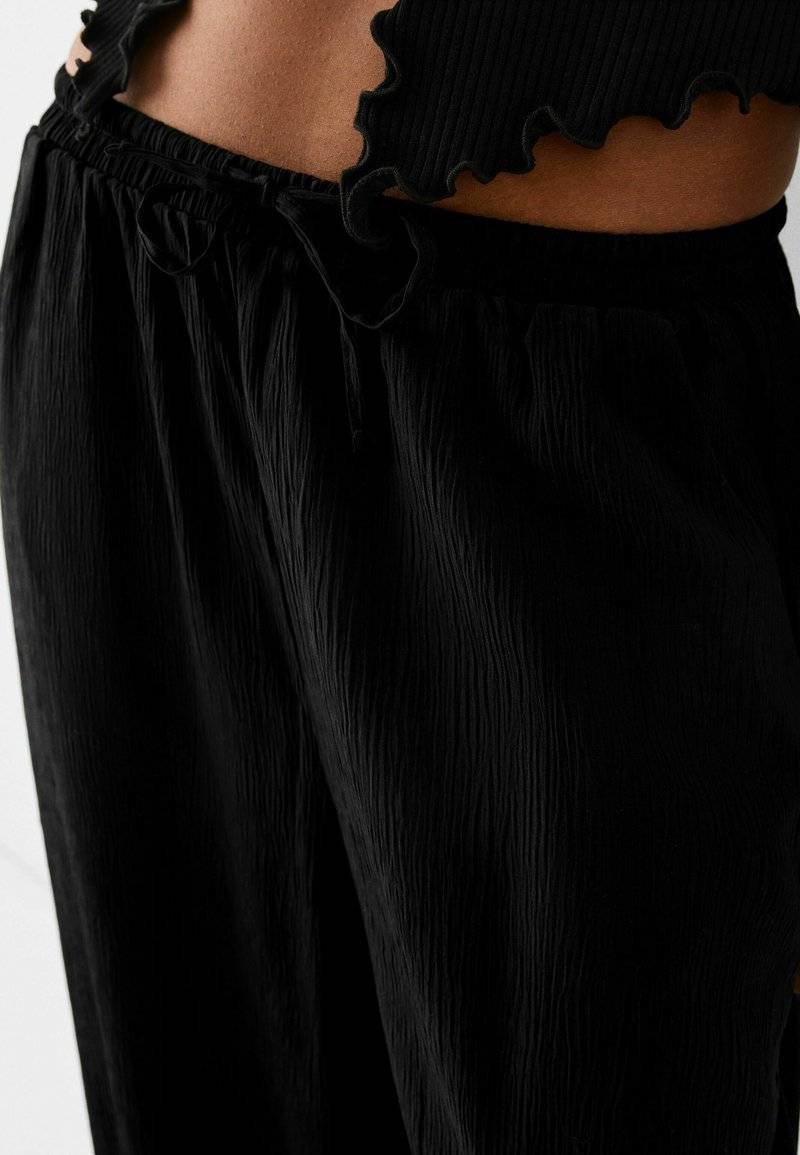 Bershka Bershka Trousers - black Bis zu 55% Rabatt