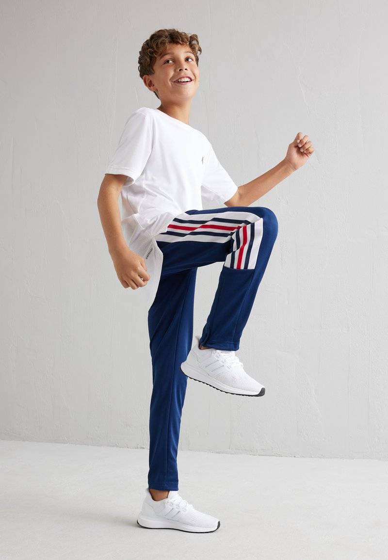 adidas Performance adidas Performance TIRO NATIONS PACK UNISEX - Tracksuit bottoms Outlet