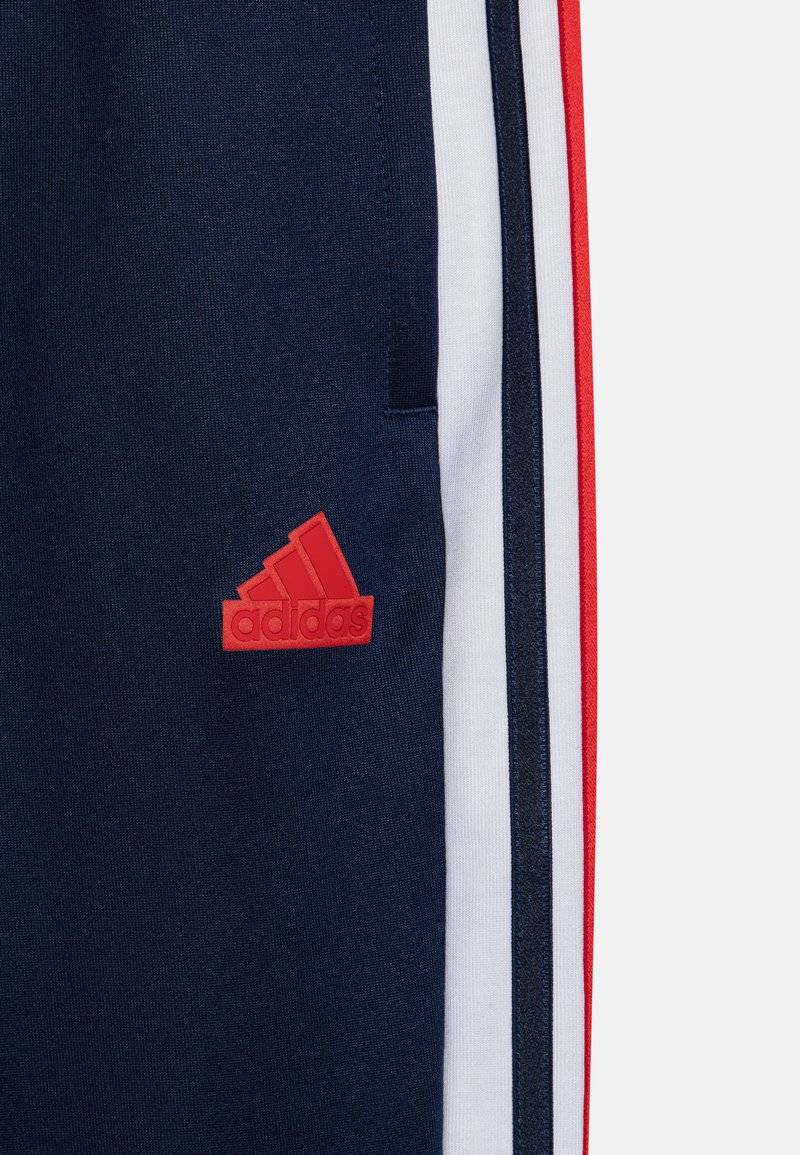 adidas Performance adidas Performance TIRO NATIONS PACK UNISEX - Tracksuit bottoms Outlet