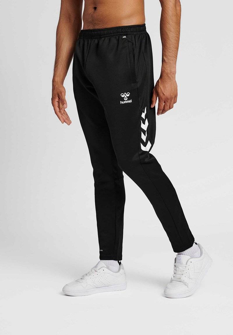 Hummel Hummel CORE XR TRAINING PANTS - Tracksuit bottoms - black im Angebot