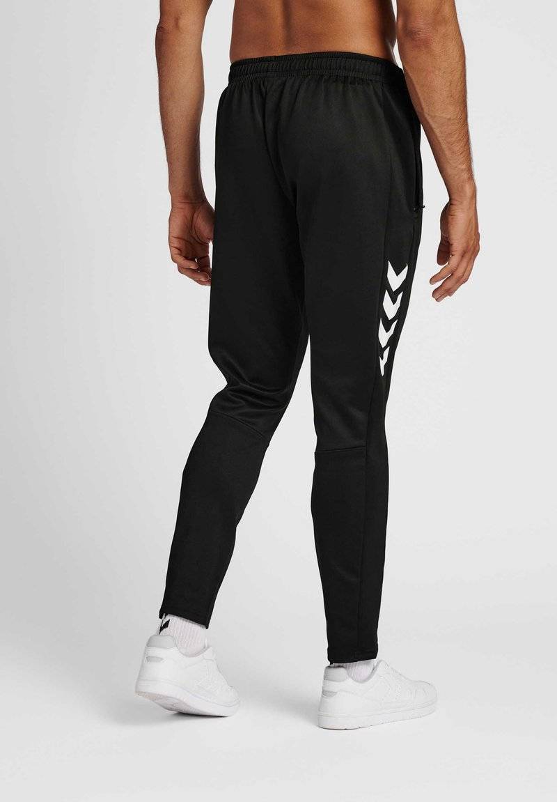 Hummel Hummel CORE XR TRAINING PANTS - Tracksuit bottoms - black im Angebot