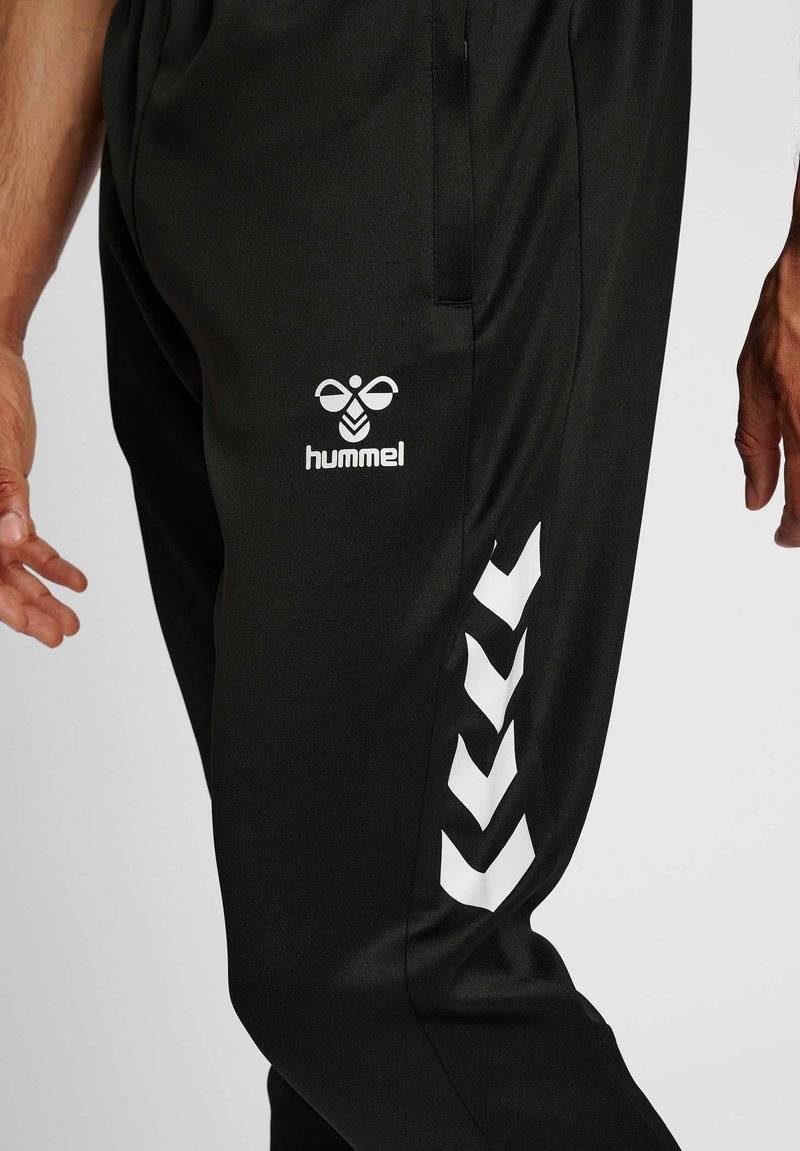Hummel Hummel CORE XR TRAINING PANTS - Tracksuit bottoms - black im Angebot