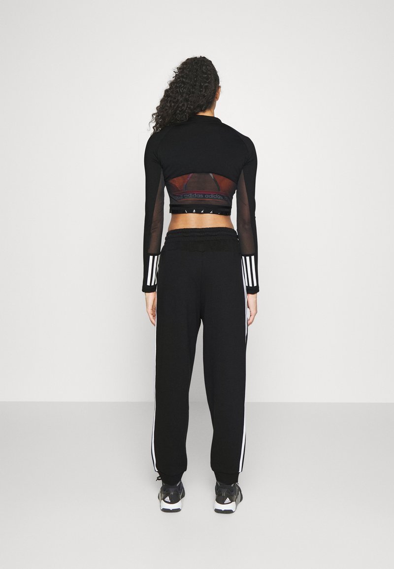 adidas Sportswear adidas Sportswear ESSENTIALS 3-STRIPES LOOSE-FIT - Tracksuit bottoms Günstig kaufen