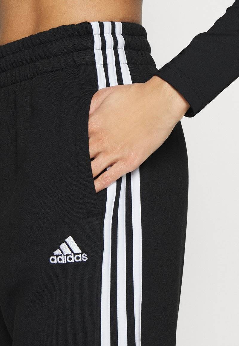adidas Sportswear adidas Sportswear ESSENTIALS 3-STRIPES LOOSE-FIT - Tracksuit bottoms Günstig kaufen