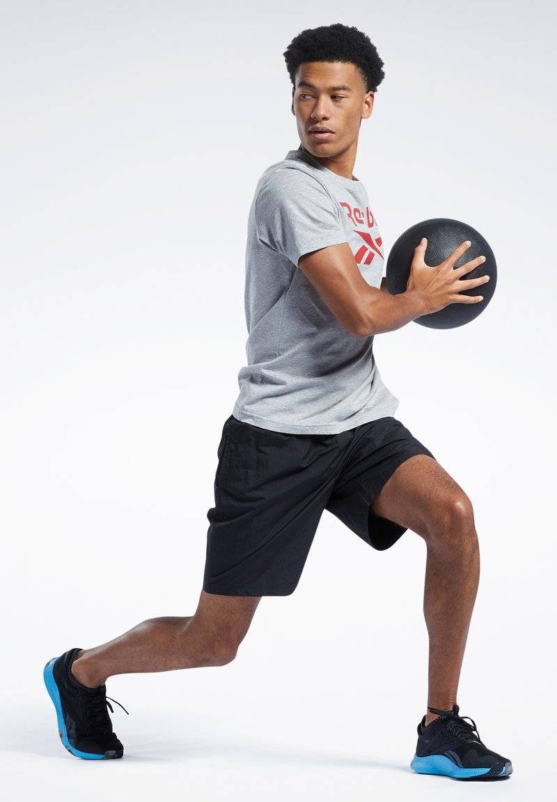 Reebok Reebok ID TRAIN UTILITY - Sports shorts - black Versandkostenfrei