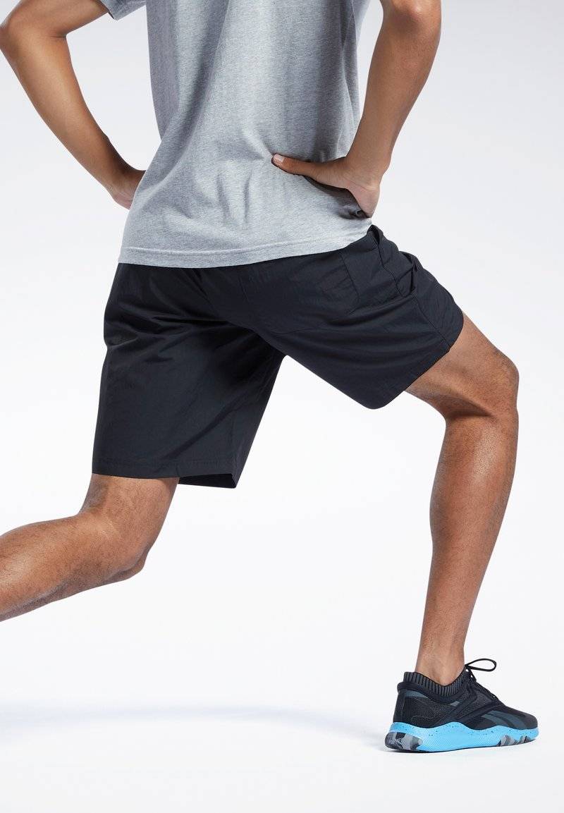 Reebok Reebok ID TRAIN UTILITY - Sports shorts - black Versandkostenfrei