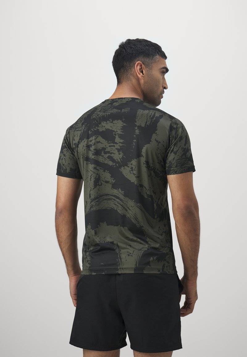 Puma Puma TRAIN ALL DAY TEE - Print T-shirt - dark olive Hotsell