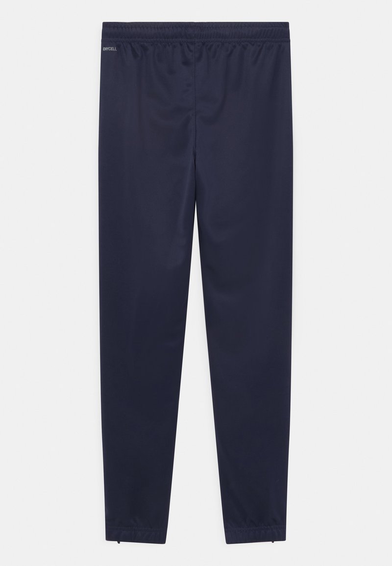 Puma Puma TEAMRISE POLY TRAINING UNISEX - Tracksuit bottoms 2025