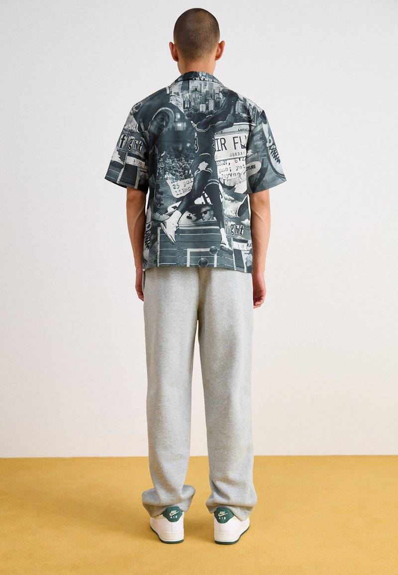 Nike Sportswear Nike Sportswear BUNGIE PANT - Tracksuit bottoms - grey heather Exklusive Angebote
