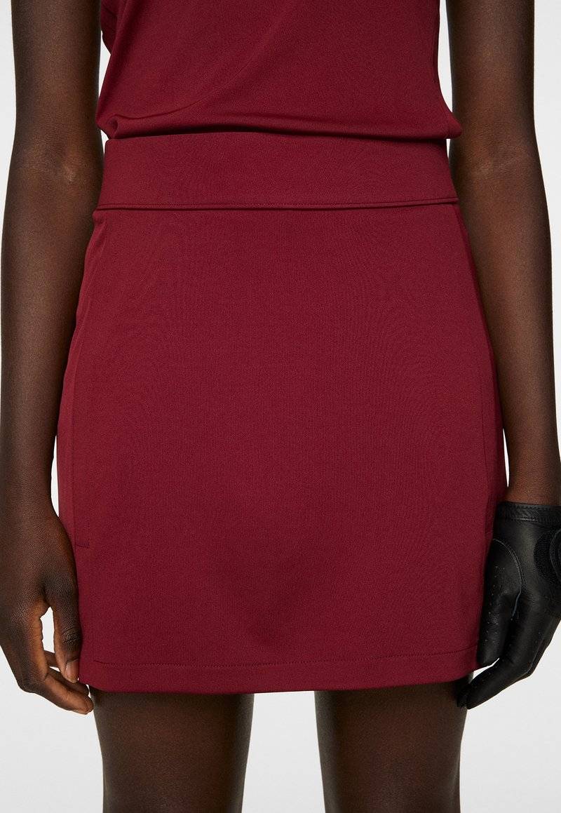 J.LINDEBERG Sports J.LINDEBERG Sports AMELIE MID - Sports skirt - cabernet Weihnachtsangebot