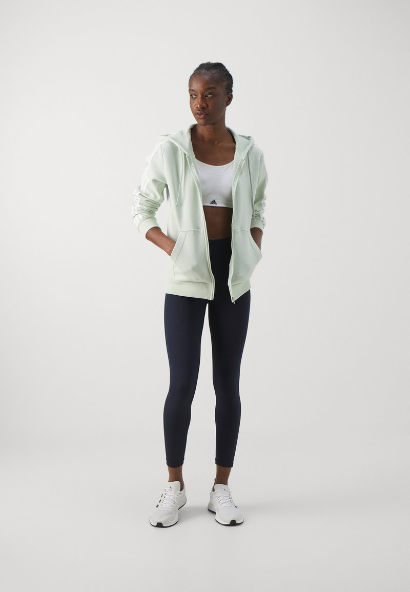 adidas Sportswear adidas Sportswear ESSENTIALS 3 STRIPES FULL ZIP HOODIE - Zip-up sweatshirt - linen green Bestseller