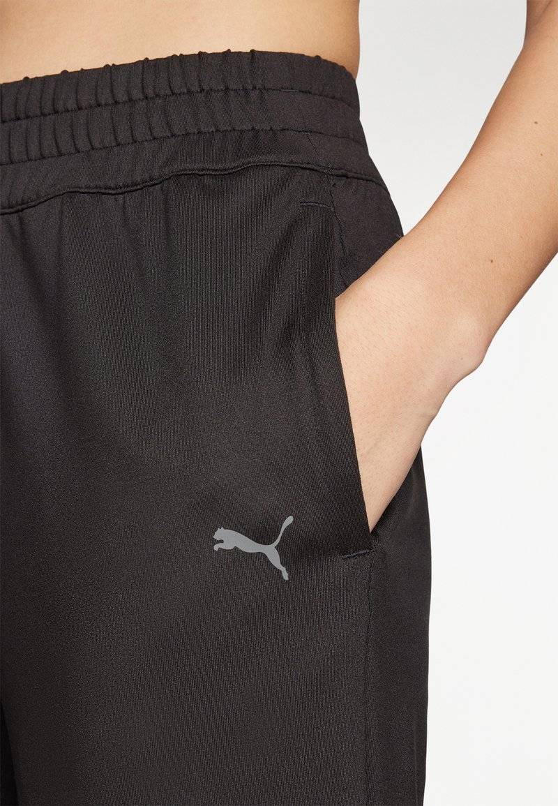 Puma Puma STUDIO FOUNDATIONS - Tracksuit bottoms - black Auslauf