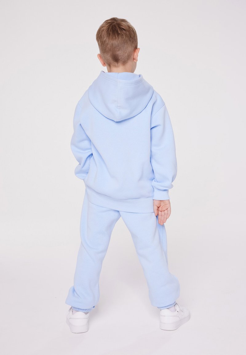 Champion Champion EXCLUSIVE PANT UNISEX - Tracksuit bottoms - light blue Heißer Verkauf