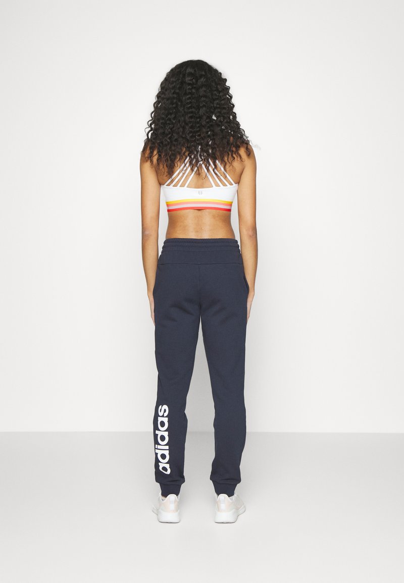 adidas Sportswear adidas Sportswear ESSENTIALS LINEAR CUFFED - Tracksuit bottoms - legend ink Kostenlose Rückgabe