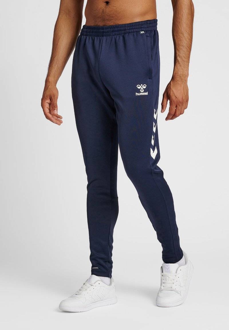 Hummel Hummel CORE XR TRAINING PANTS - Tracksuit bottoms - marine