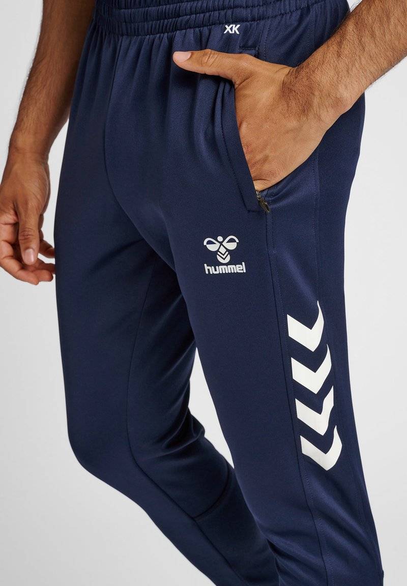 Hummel Hummel CORE XR TRAINING PANTS - Tracksuit bottoms - marine Hotsell